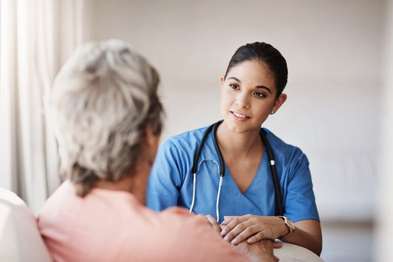 Nurse supporting a client at home